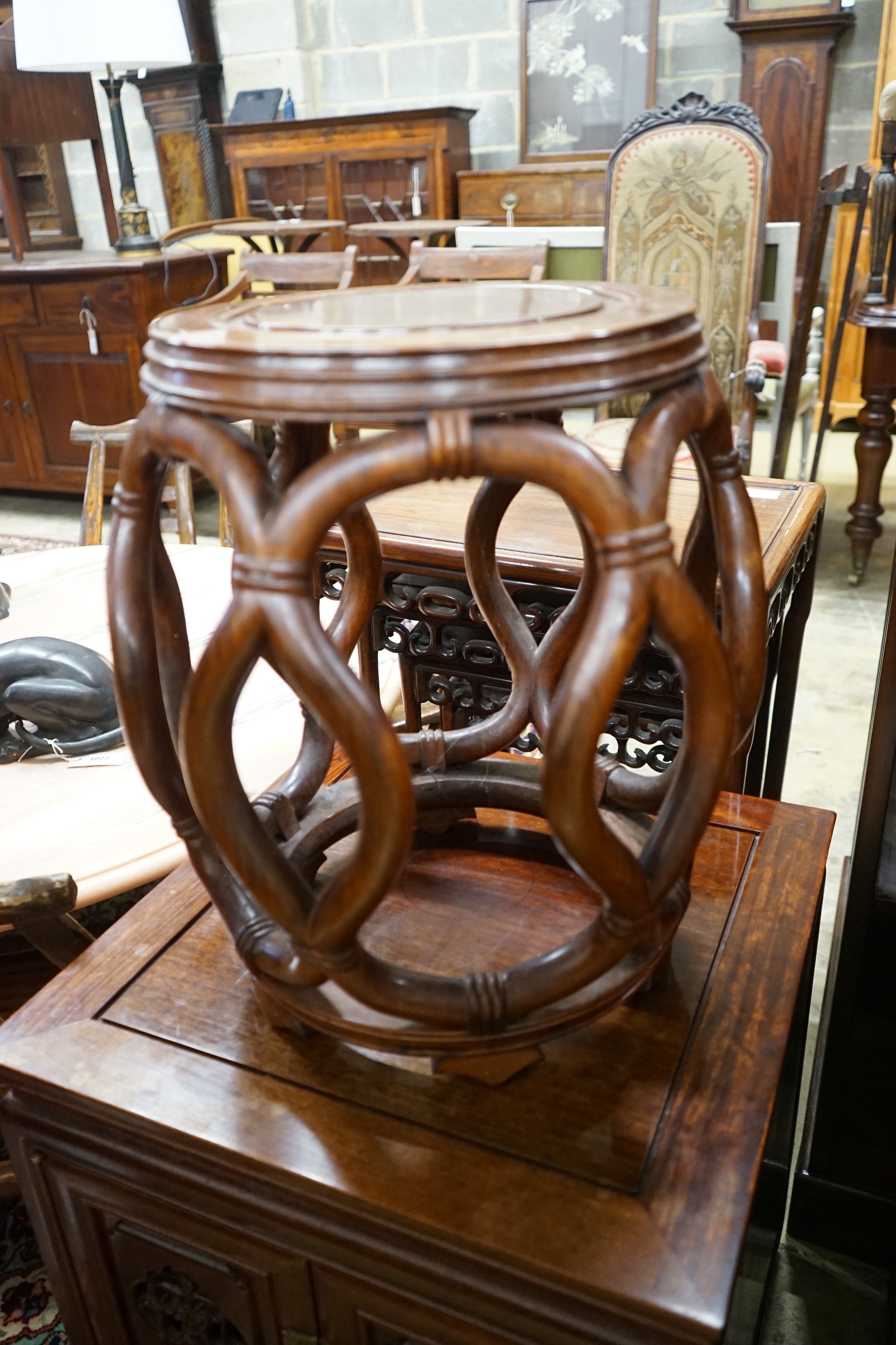 A pair of Chinese padouk wood jardiniere stands, diameter 38cm, height 46cm